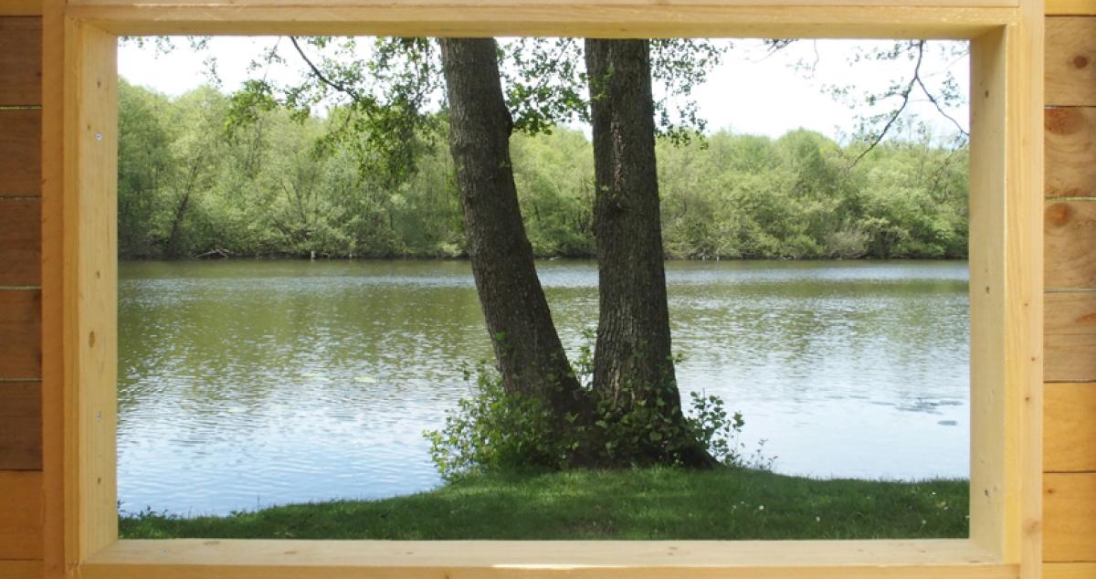 Paysage cadré depuis la capsule 1 au parc de Breteuil-sur-Iton